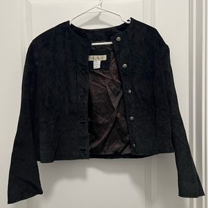 A crop black button up suede jacket.